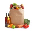 Paper bag with different groceries on white Royalty Free Stock Photo