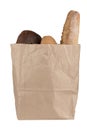 Paper bag with different types of bread isolated on white background. Royalty Free Stock Photo