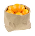 Paper bag filled with small oranges Royalty Free Stock Photo