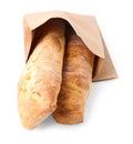 Paper bag with fresh baguettes isolated on white Royalty Free Stock Photo