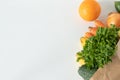 Paper bag with fresh plant-based groceries: vegetables and fruits Royalty Free Stock Photo