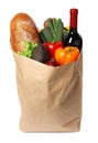 Paper bag with fresh vegetables, bread and bottle of wine Royalty Free Stock Photo