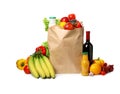 Paper bag with groceries on white Royalty Free Stock Photo