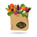 100 percent natural, organic on a paper bag full of fresh vegetables. Concept of diet, vegetarian, vegan. Grocery delivery