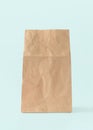 Paper bag isolated on white blue background with clipping path, eco-friendly brown food package mockup for lunch, breakfast Royalty Free Stock Photo