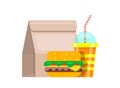 Paper bag lunch fast food. Bag food juicy fresh hamburger striped glass soda. Royalty Free Stock Photo