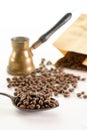 Paper bag pouch mock up with coffee beans and spoon turk on white background isolated Royalty Free Stock Photo