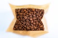Paper bag pouch mock up with coffee beans and spoon turk on white background isolated Royalty Free Stock Photo
