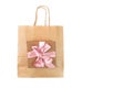 Paper bag for shopping and gift box tied with a satin pink ribbon Royalty Free Stock Photo