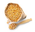 Paper bag and spoon with raw corn kernels Royalty Free Stock Photo