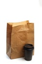 Paper bag on white background with coffee cup  Mockup for design Royalty Free Stock Photo