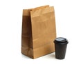 Paper bag on white background with coffee cup  Mockup for design Royalty Free Stock Photo