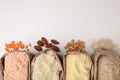 Paper bags with different types of flour on white background, top view. Space for text Royalty Free Stock Photo