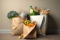 Paper bags filled with groceries floating over shopping basket Royalty Free Stock Photo
