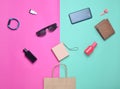 Paper bags and many purchases of gadgets and accessories on a colored background. Royalty Free Stock Photo