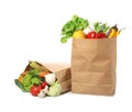 Paper bags with vegetables on white Royalty Free Stock Photo