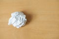 Paper ball white sheet crumpled lumpy on wooden floor background