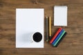 Paper blank Sheet, color markers, pencils and a cup of coffee Royalty Free Stock Photo