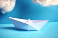 Paper boat in the blue paper sea