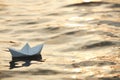 Paper boat floating on water outdoors. Space for text Royalty Free Stock Photo