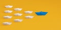 Paper boat leads blue followed by other white boat on a yellow background. Social media or internet followers concept