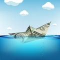 Paper boat made from dollar currency sinking in water Royalty Free Stock Photo