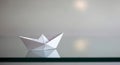 Paper Boat on Reflective Surface Royalty Free Stock Photo