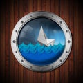 Paper Boat Sinking in the Stormy Sea seen through the Porthole Royalty Free Stock Photo