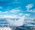 Paper boat in stormy sea Royalty Free Stock Photo