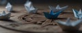 The Paper Boats Sailing on a Wooden Compass Background.AI generated image Royalty Free Stock Photo