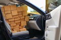 Paper box post package of product full in car preparing delivery for customer order, image used for shipment logistic