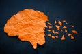 Paper brain with torn pieces. The concept of memory problems and Alzheimer disease. Royalty Free Stock Photo