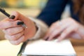 paper in business woman female hand writing notes on a table black manicure and blank letter Royalty Free Stock Photo