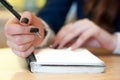 paper in business woman female hand writing notes on a table black manicure and blank letter Royalty Free Stock Photo