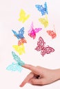 Paper butterflies fly out of girls hands