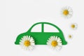 Paper car cut-out with daisy flowers - Ecolology car concept