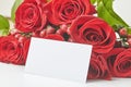 Paper card and bouquet of roses isolated on white background