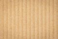 Paper cardboard background. Macro top view of natural corrugated carton sheet. Kraft cardboard texture with vertical stripes Royalty Free Stock Photo