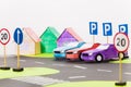 Paper cars models standing in a row on the parking Royalty Free Stock Photo