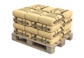 Paper cement bags in stack on wooden pallet Royalty Free Stock Photo