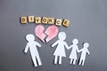 Paper chain cut family with broken heart on gray background. Divorce and broken family concept Royalty Free Stock Photo