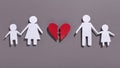 Paper chain family cut out with broken heart on gray Royalty Free Stock Photo