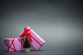 Paper Christmas tree and gifts on gray background.