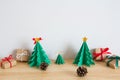 Paper christmas tree with presents and pines Royalty Free Stock Photo