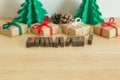 Paper christmas tree with presents, pines and the word Merry Christmas Royalty Free Stock Photo