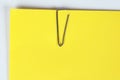 Paper clip holding on blank colour paper text