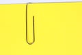 Paper clip holding on blank colour paper text