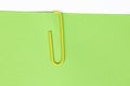 Paper clip holding on blank colour paper text Royalty Free Stock Photo