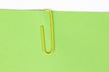 Paper clip holding on blank colour paper text