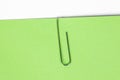 Paper clip holding on blank colour paper text